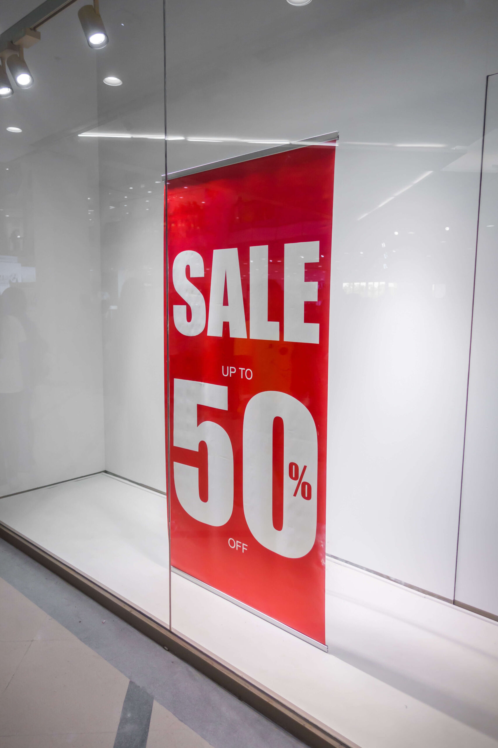red-store-discount-sign-shop-window